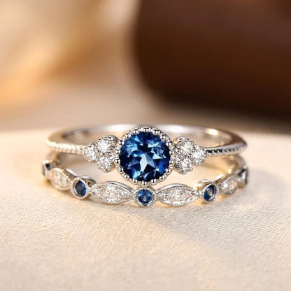 Halo-Ring mit Saphir in Silber